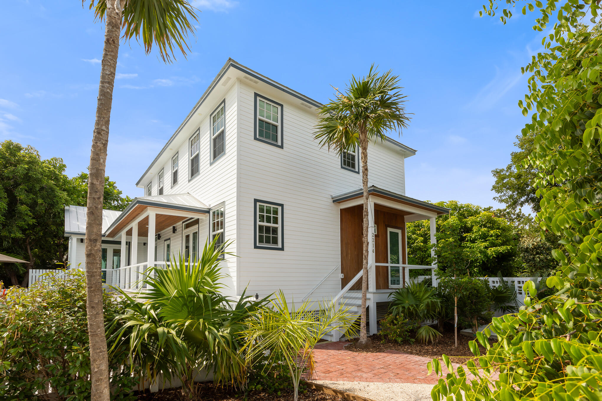 2214 Seidenberg Avenue Key West, FL 33040 - Photo 3 of 37 a front view of a house with a yard