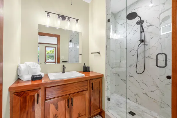 a bathroom with a sink and mirror