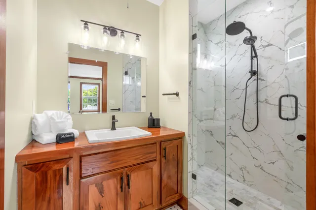 a bathroom with a sink and mirror