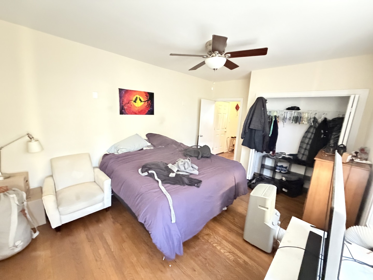 3153 West Augusta Boulevard, Unit 3B Chicago, IL 60622 - Photo 8 of 12 a living room with furniture and a flat screen tv