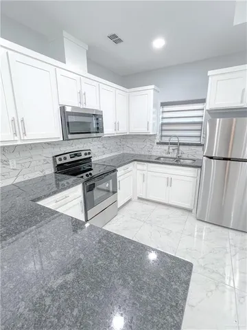 a view of a chandelier and chandelier in a room