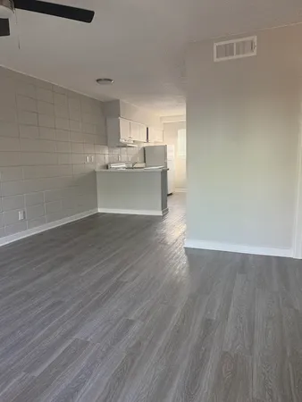a view of kitchen and wooden floor