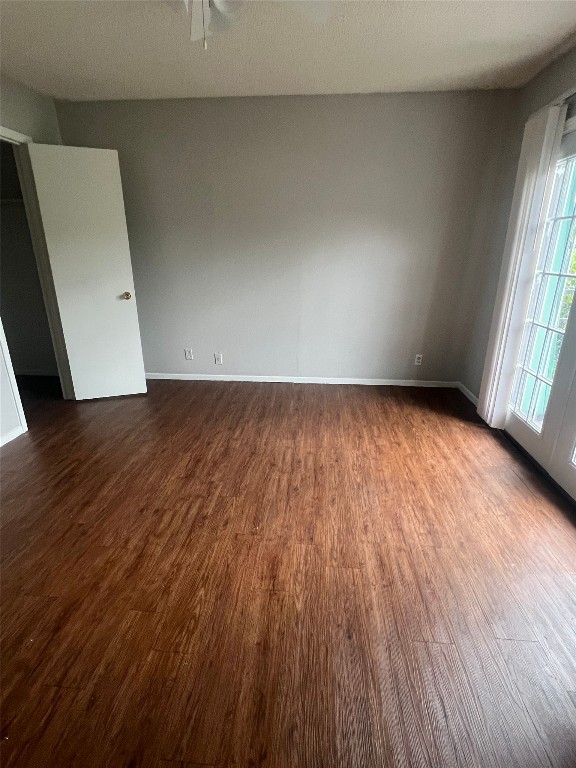 311 East 31st Street, Unit 308 Austin, TX 78705 - Photo 12 of 26 an empty room with wooden floor and windows