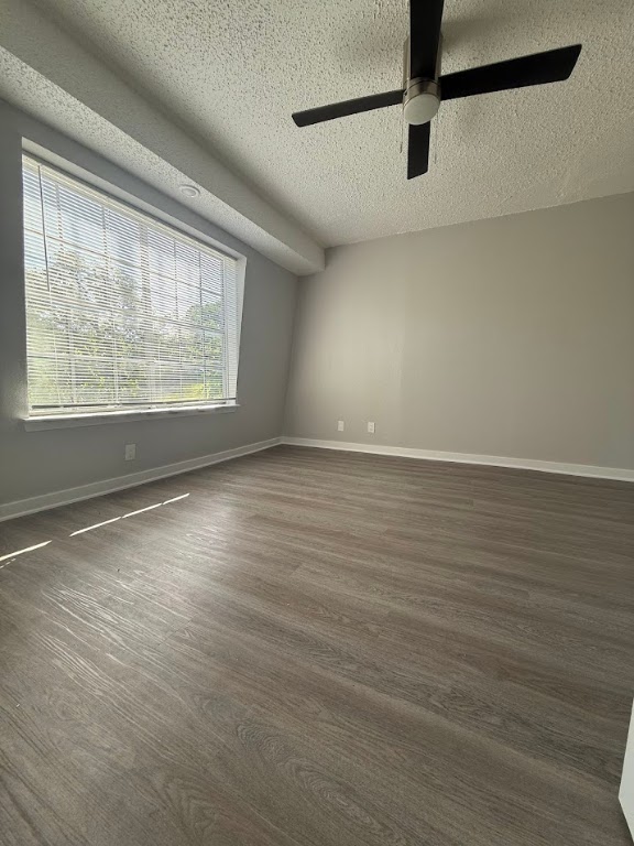 311 East 31st Street, Unit 202 Austin, TX 78705 - Photo 13 of 24 an empty room with wooden floor and windows