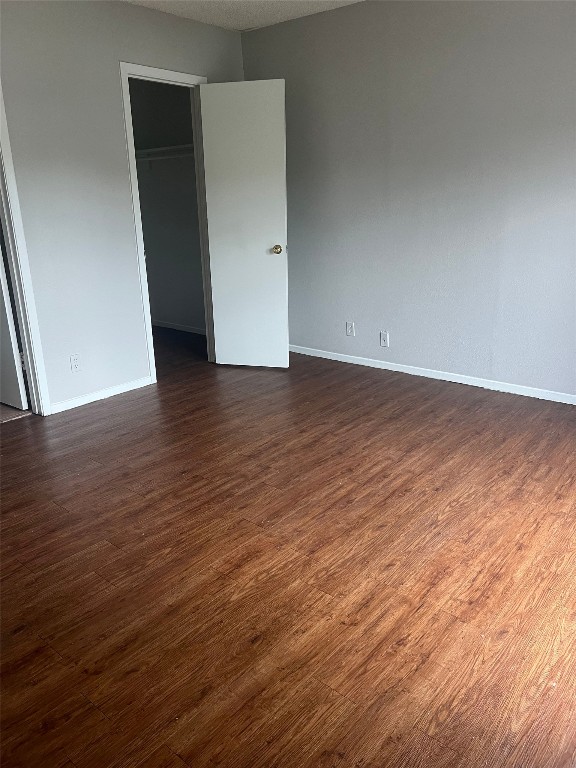 311 East 31st Street, Unit 308 Austin, TX 78705 - Photo 13 of 26 an empty room with wooden floor
