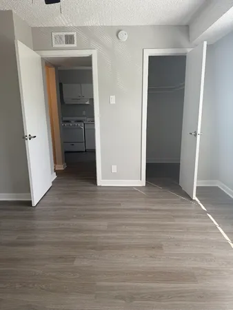 a view of hallway with wooden floor