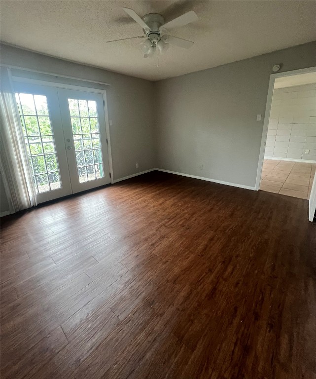 311 East 31st Street, Unit 308 Austin, TX 78705 - Photo 19 of 26 an empty room with wooden floor and windows