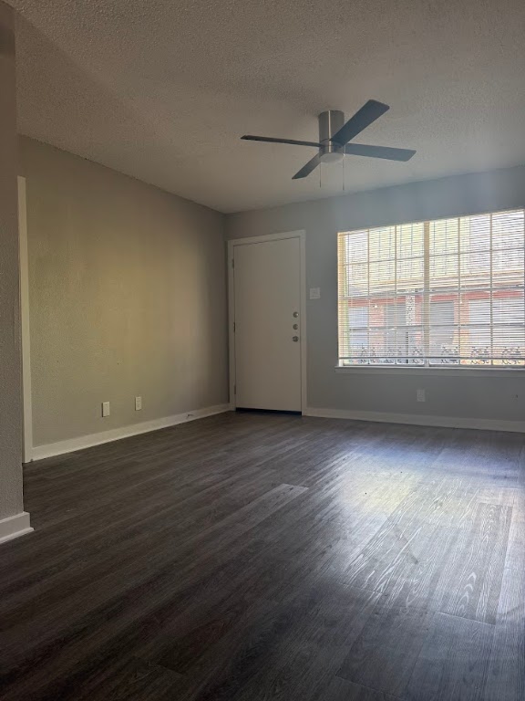 311 East 31st Street, Unit 202 Austin, TX 78705 - Photo 4 of 24 a view of an empty room with wooden floor and a window