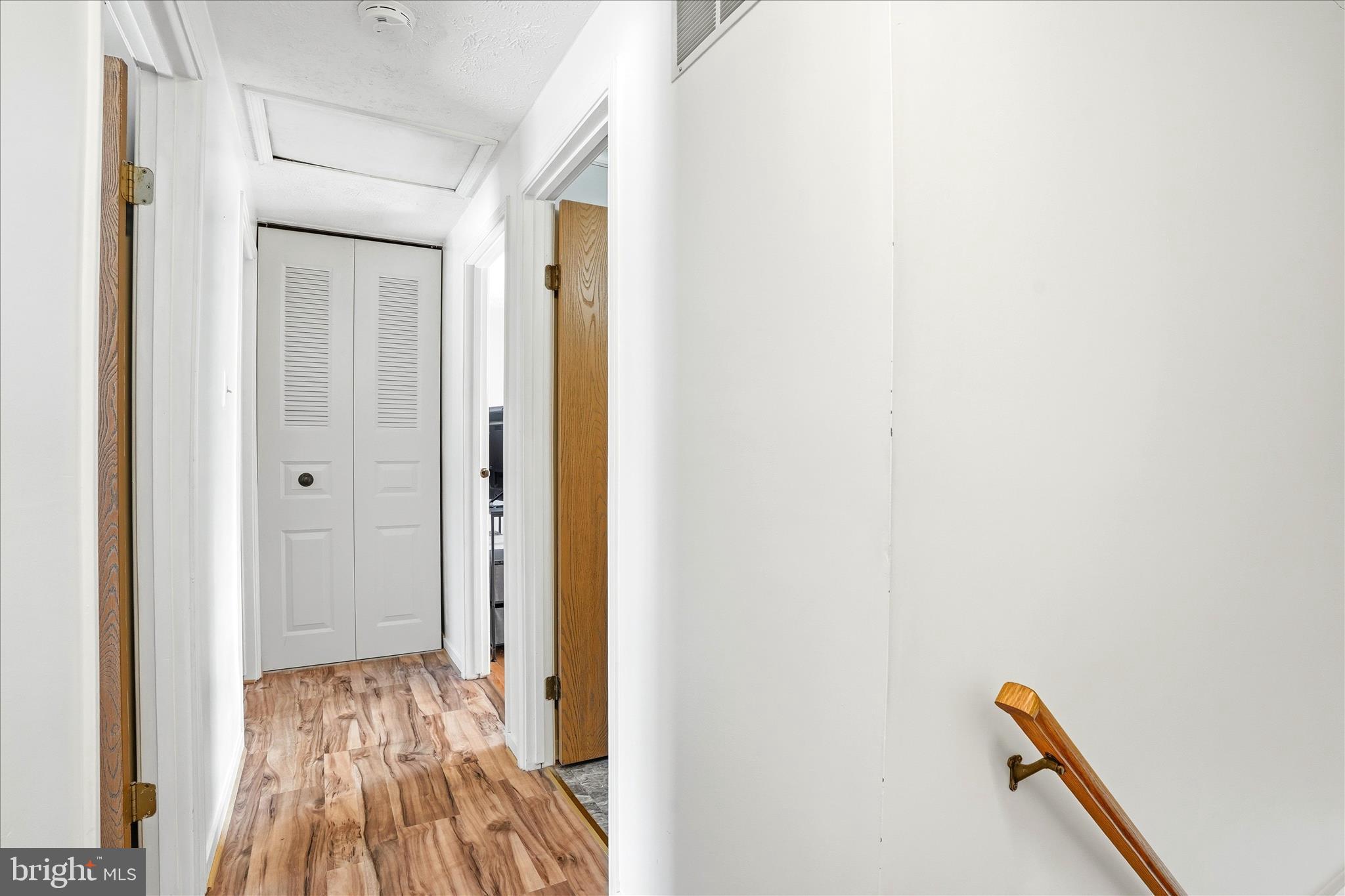 76 Hook Road Westminster, MD 21157 - Photo 15 of 38 a view of a hallway with wooden floor and a bathroom