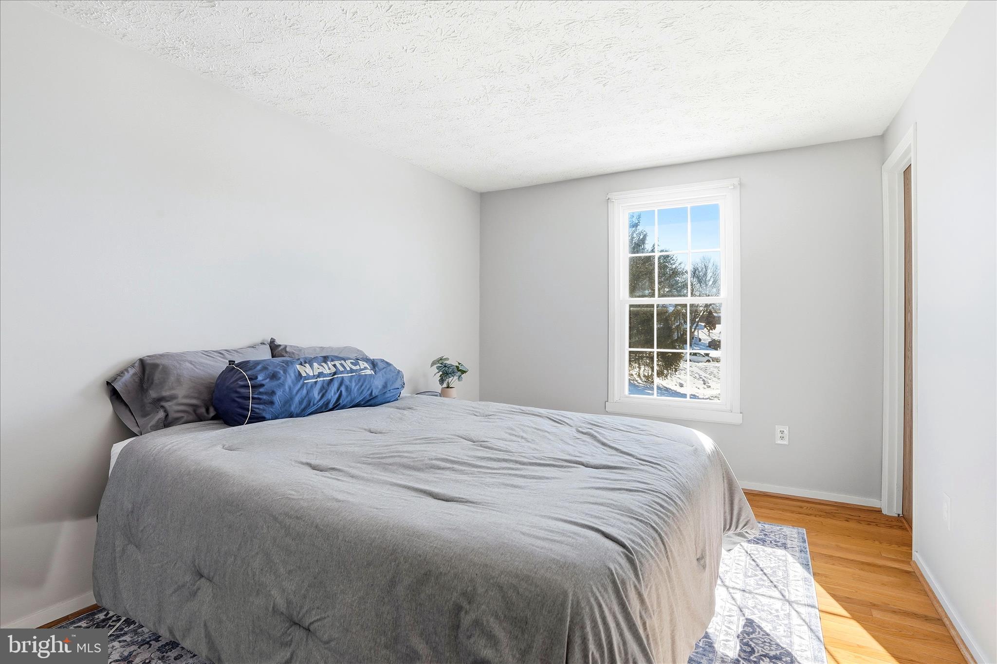 76 Hook Road Westminster, MD 21157 - Photo 16 of 38 a bedroom with a bed and a window