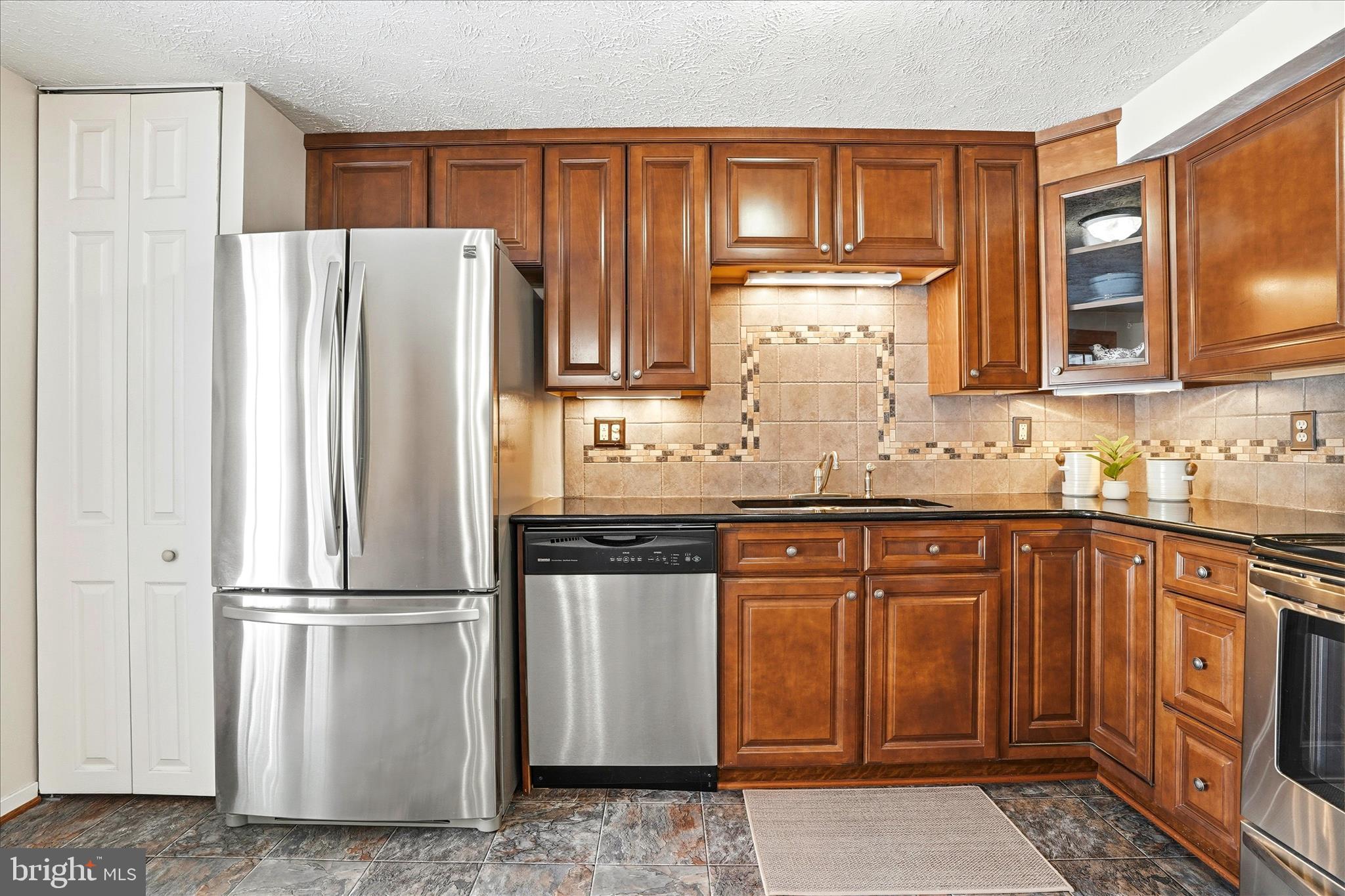 76 Hook Road Westminster, MD 21157 - Photo 6 of 38 a kitchen with stainless steel appliances granite countertop a refrigerator sink and cabinets
