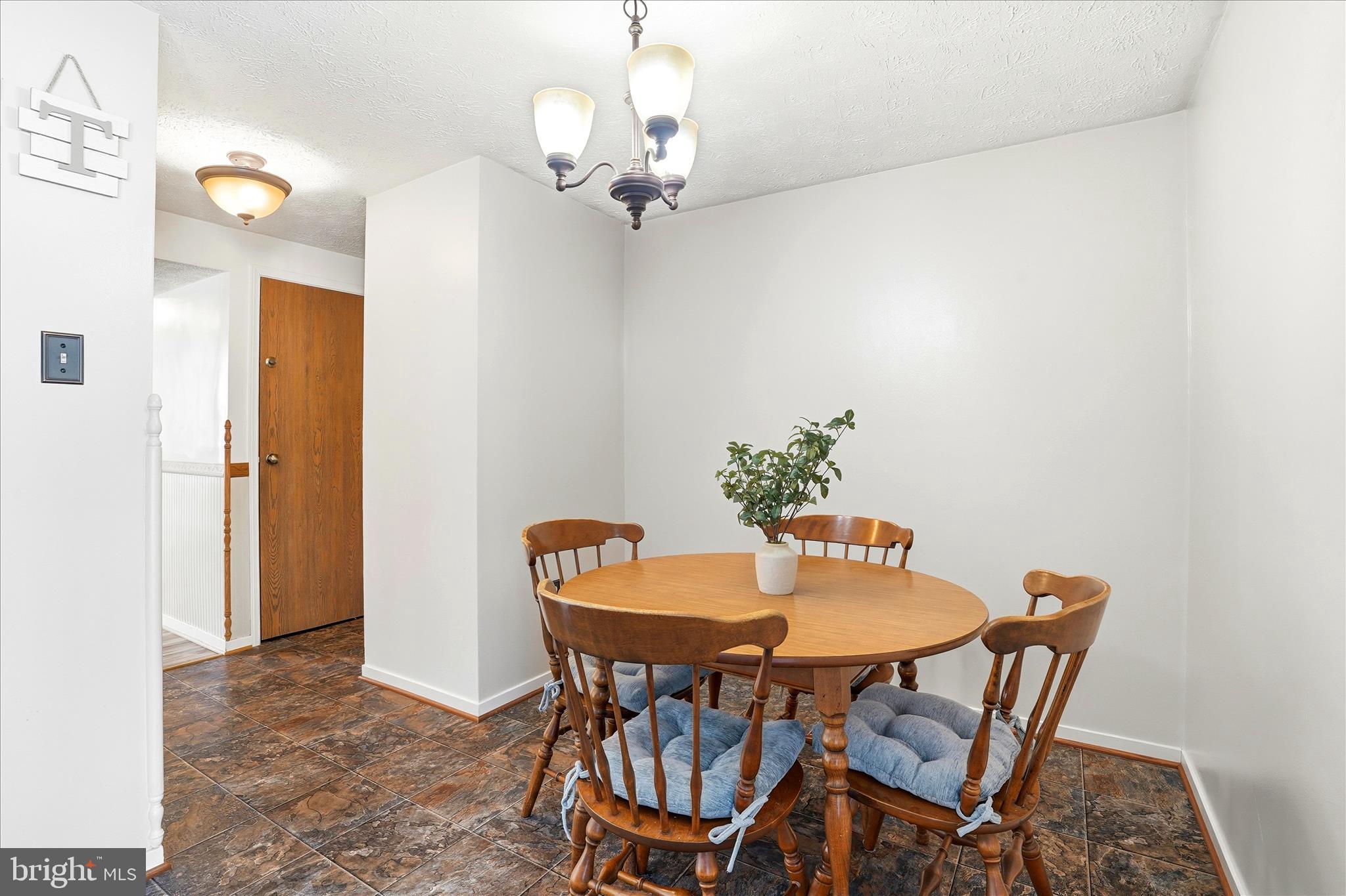 76 Hook Road Westminster, MD 21157 - Photo 10 of 38 a dining room with furniture and chandelier