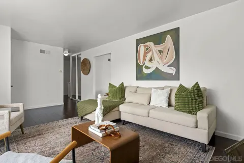 a living room with furniture and a rug