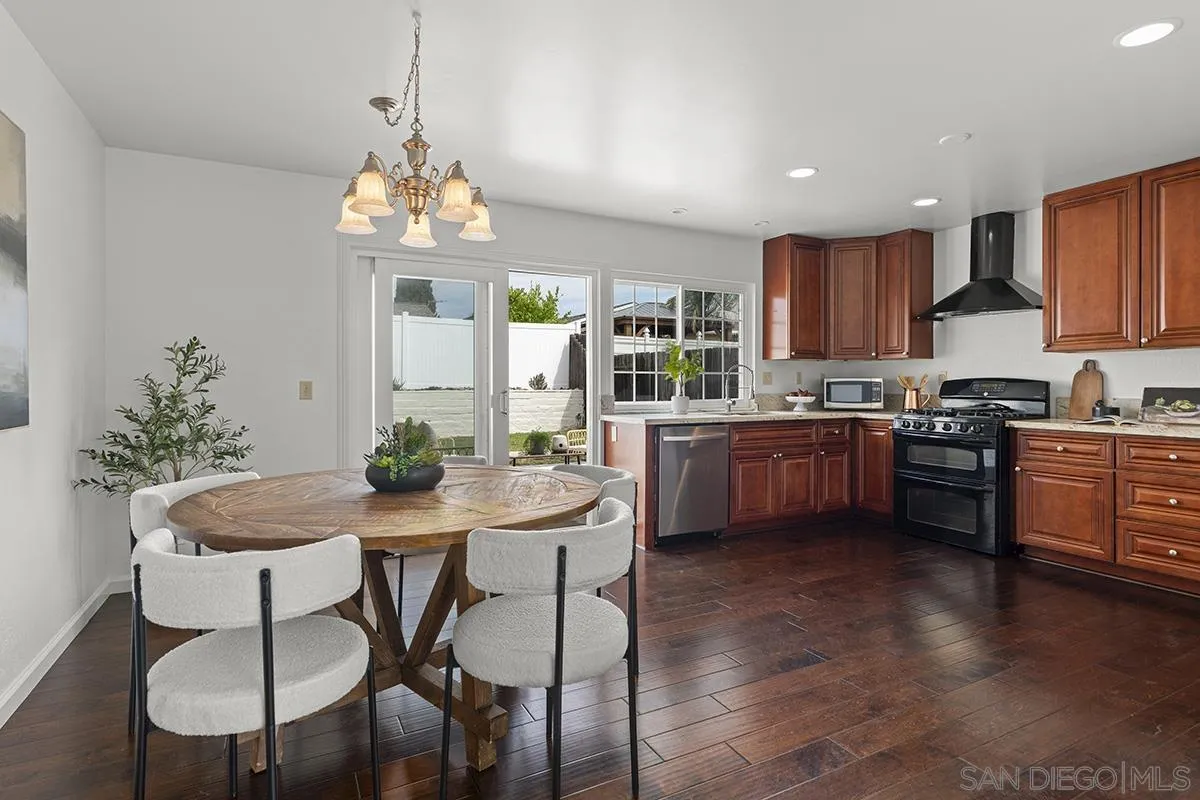 11394 Pegasus Avenue San Diego, CA 92126 - Photo 13 of 46 a kitchen with a table and chairs in it