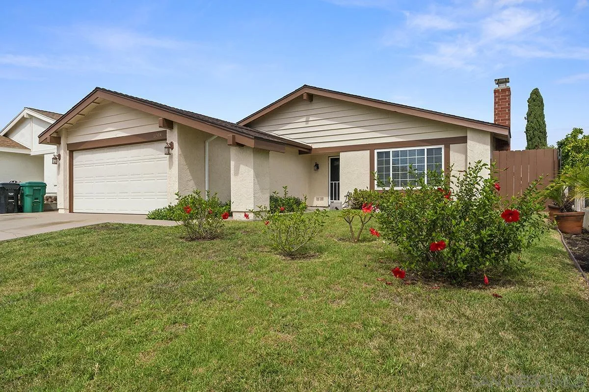 11394 Pegasus Avenue San Diego, CA 92126 - Photo 2 of 46 a front view of house with yard and green space