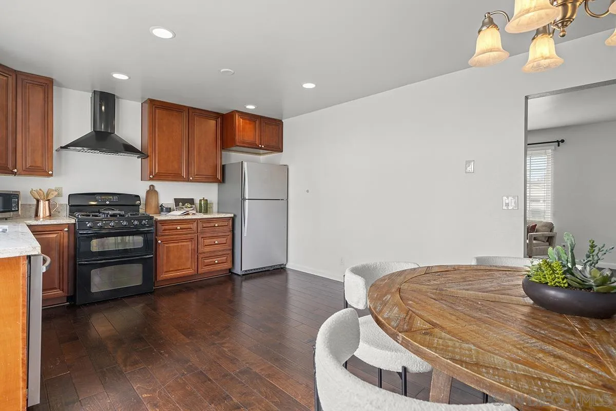 11394 Pegasus Avenue San Diego, CA 92126 - Photo 21 of 46 a kitchen with stainless steel appliances a refrigerator and a stove top oven
