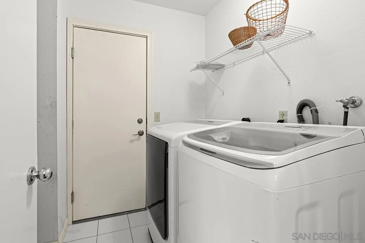 11394 Pegasus Avenue San Diego, CA 92126 - Photo 34 of 46 a bathroom with a sink and a mirror