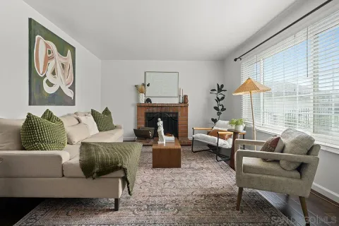 a living room with furniture a couch and a fireplace