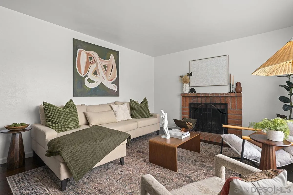 11394 Pegasus Avenue San Diego, CA 92126 - Photo 9 of 46 a living room with furniture and a fireplace