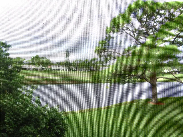 a view of a lake with a building in the background