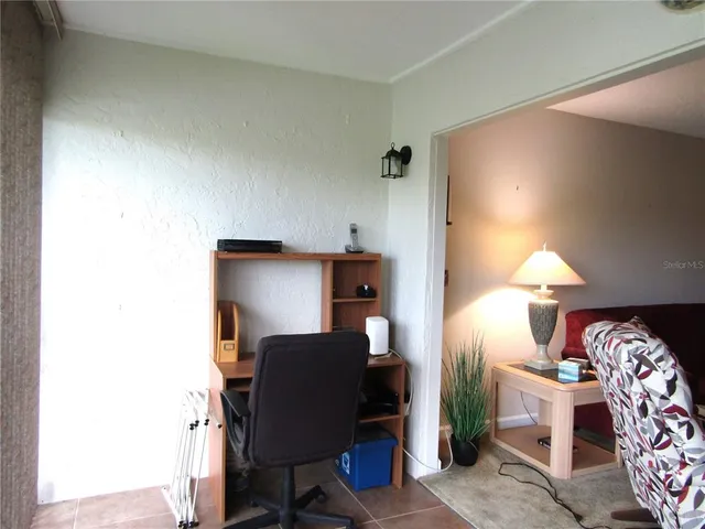 a workspace with furniture and lamp