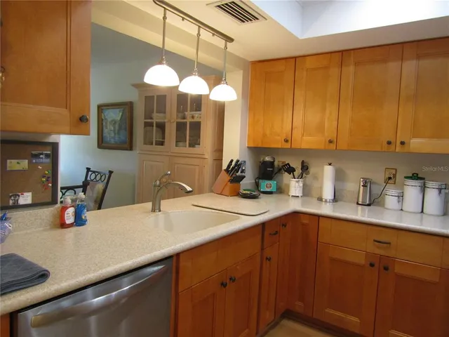 a kitchen with a sink and cabinets