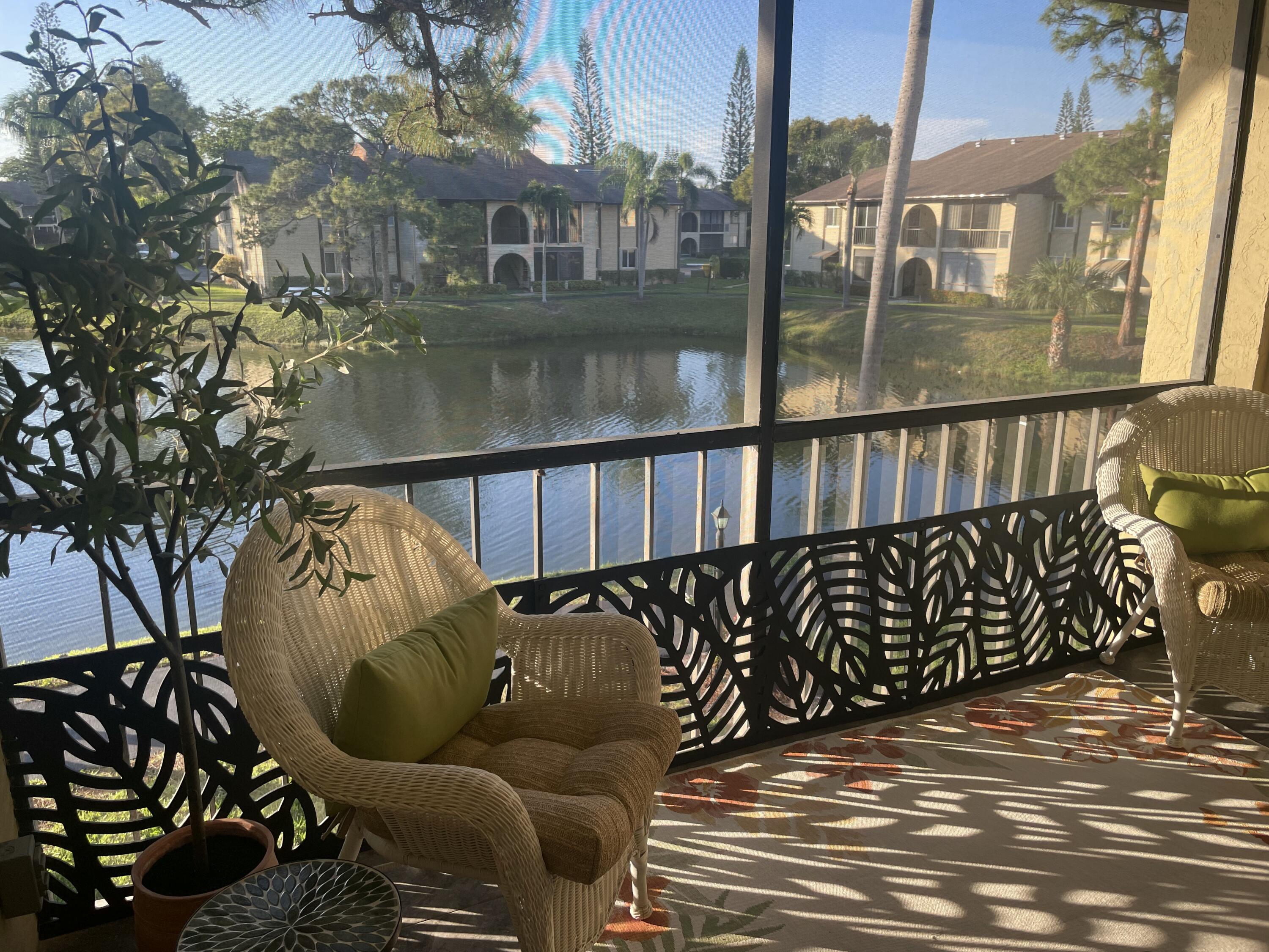 338 Pine Ridge Circle, Unit B2 Greenacres, FL 33463 - Photo 11 of 56 a view of balcony with furniture