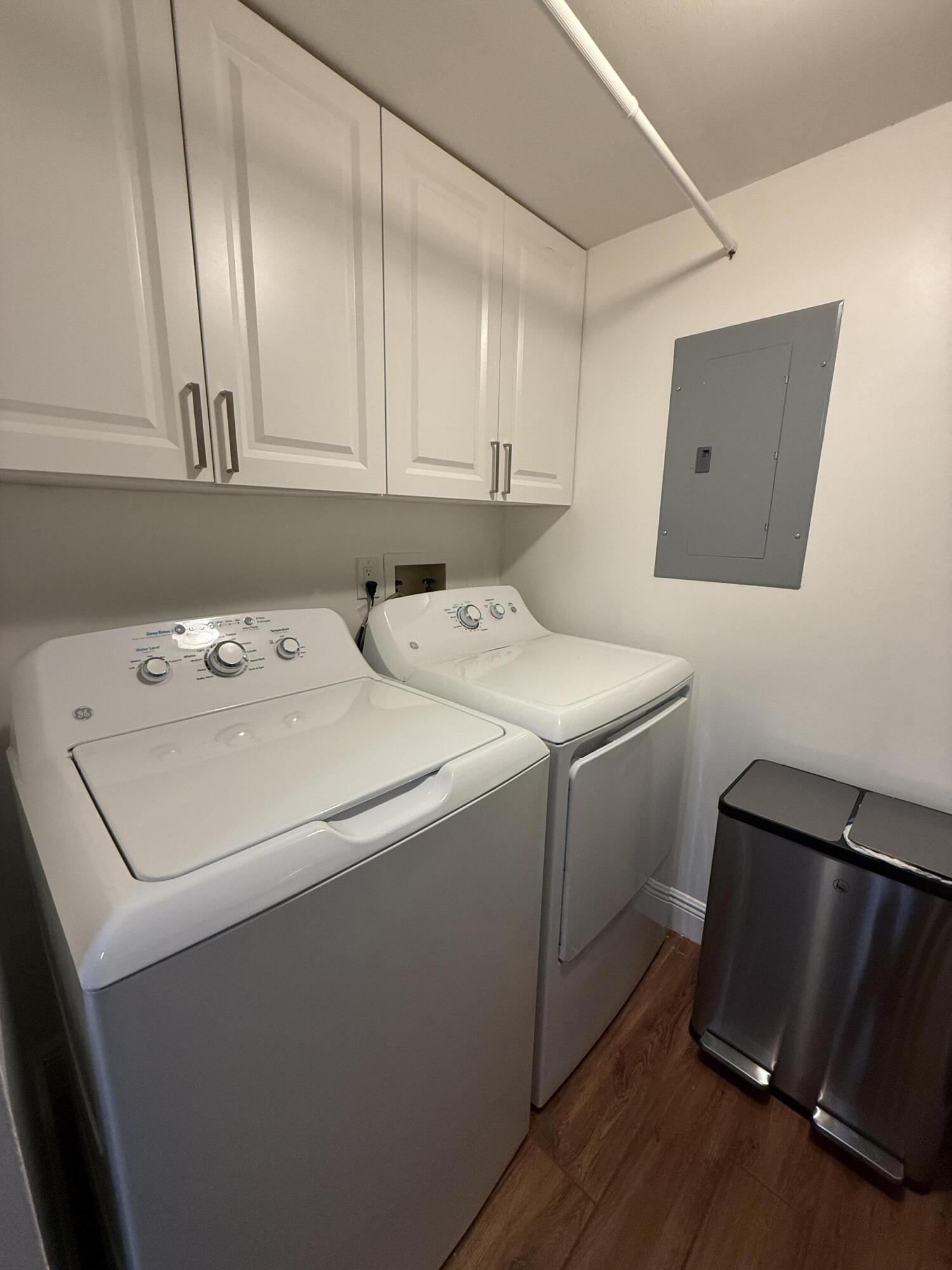 338 Pine Ridge Circle, Unit B2 Greenacres, FL 33463 - Photo 22 of 56 a utility room with dryer and washer