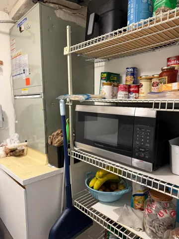 a bathroom with a toilet and a mirror