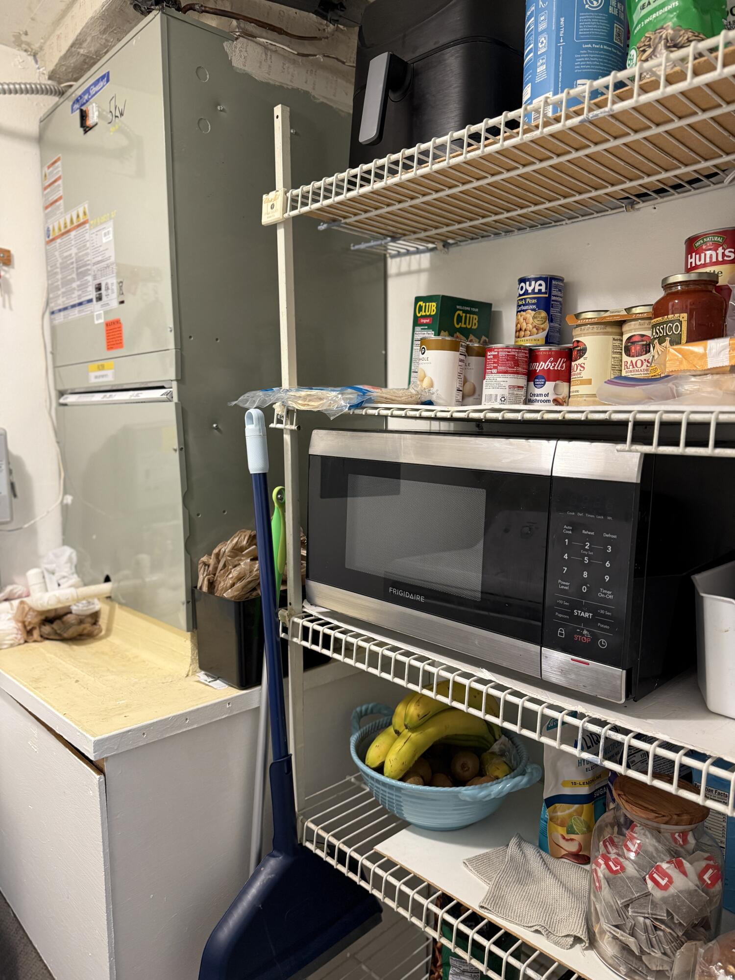 338 Pine Ridge Circle, Unit B2 Greenacres, FL 33463 - Photo 23 of 56 a kitchen with a stove and a wooden floor