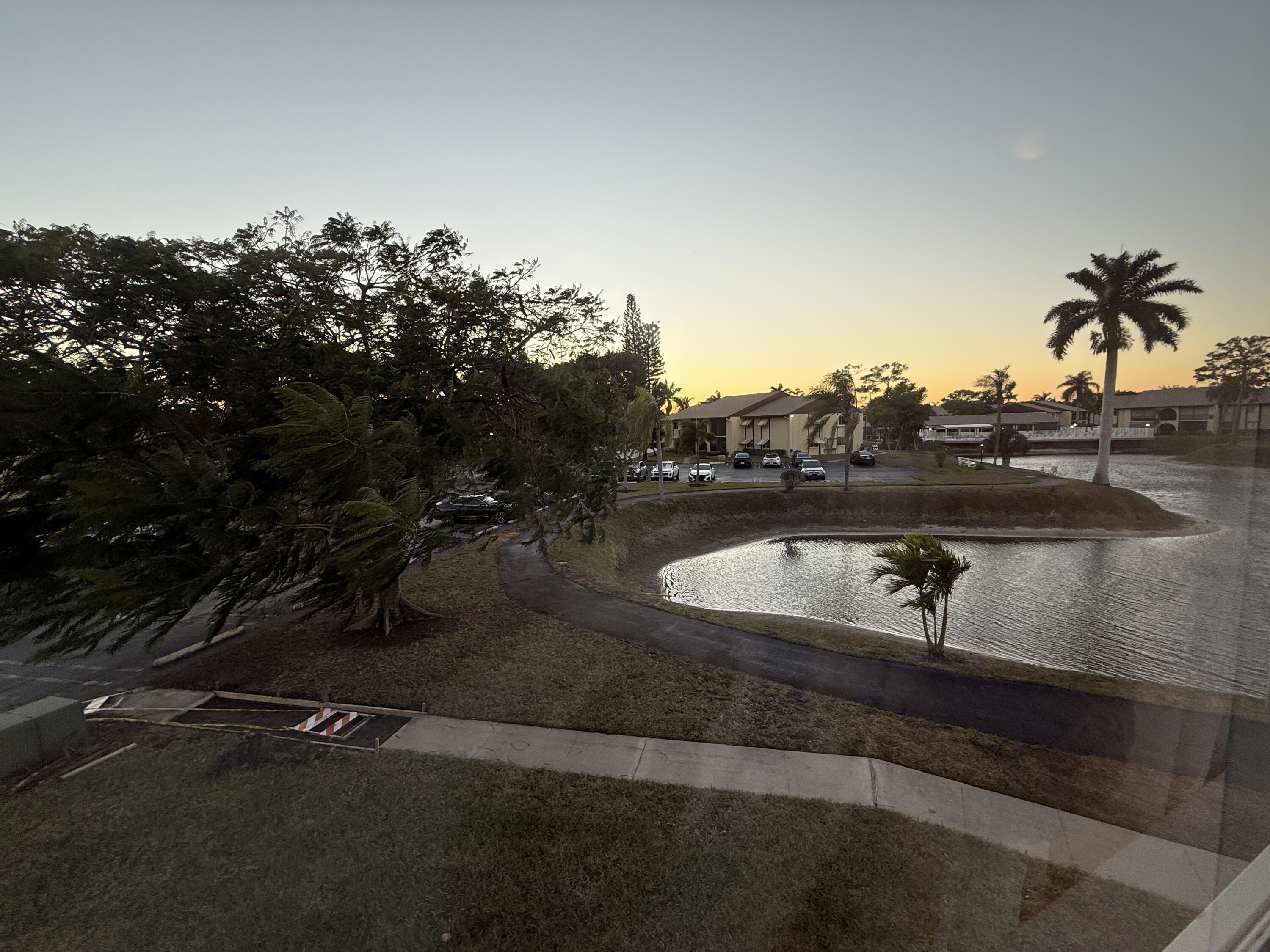 338 Pine Ridge Circle, Unit B2 Greenacres, FL 33463 - Photo 30 of 56 a view of a lake