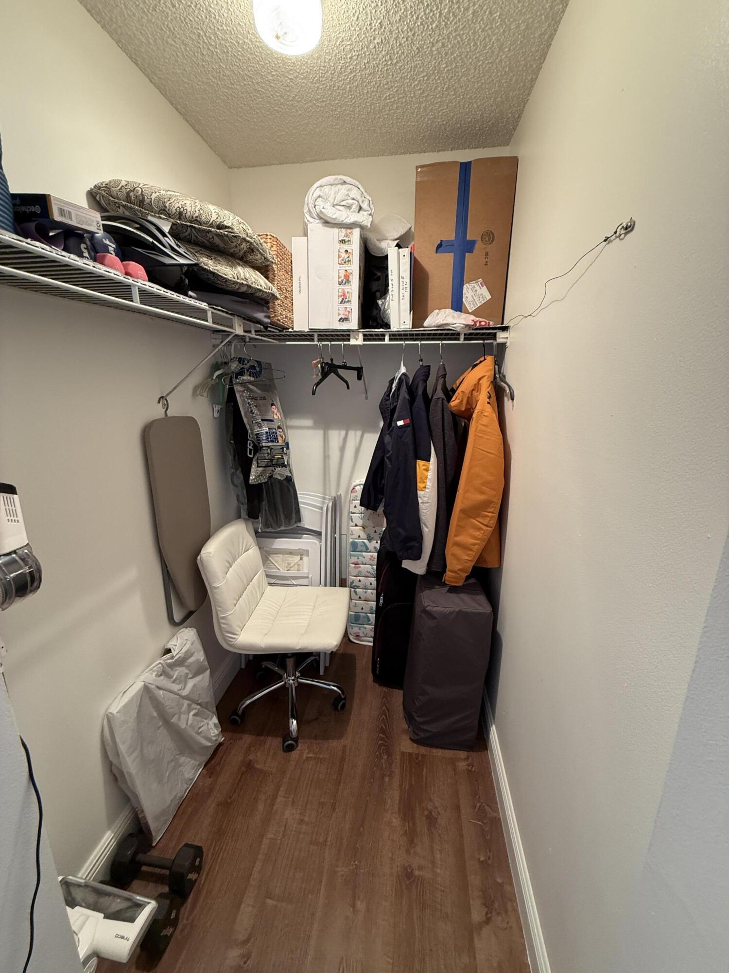 338 Pine Ridge Circle, Unit B2 Greenacres, FL 33463 - Photo 35 of 56 a view of workspace with wooden floor and chair