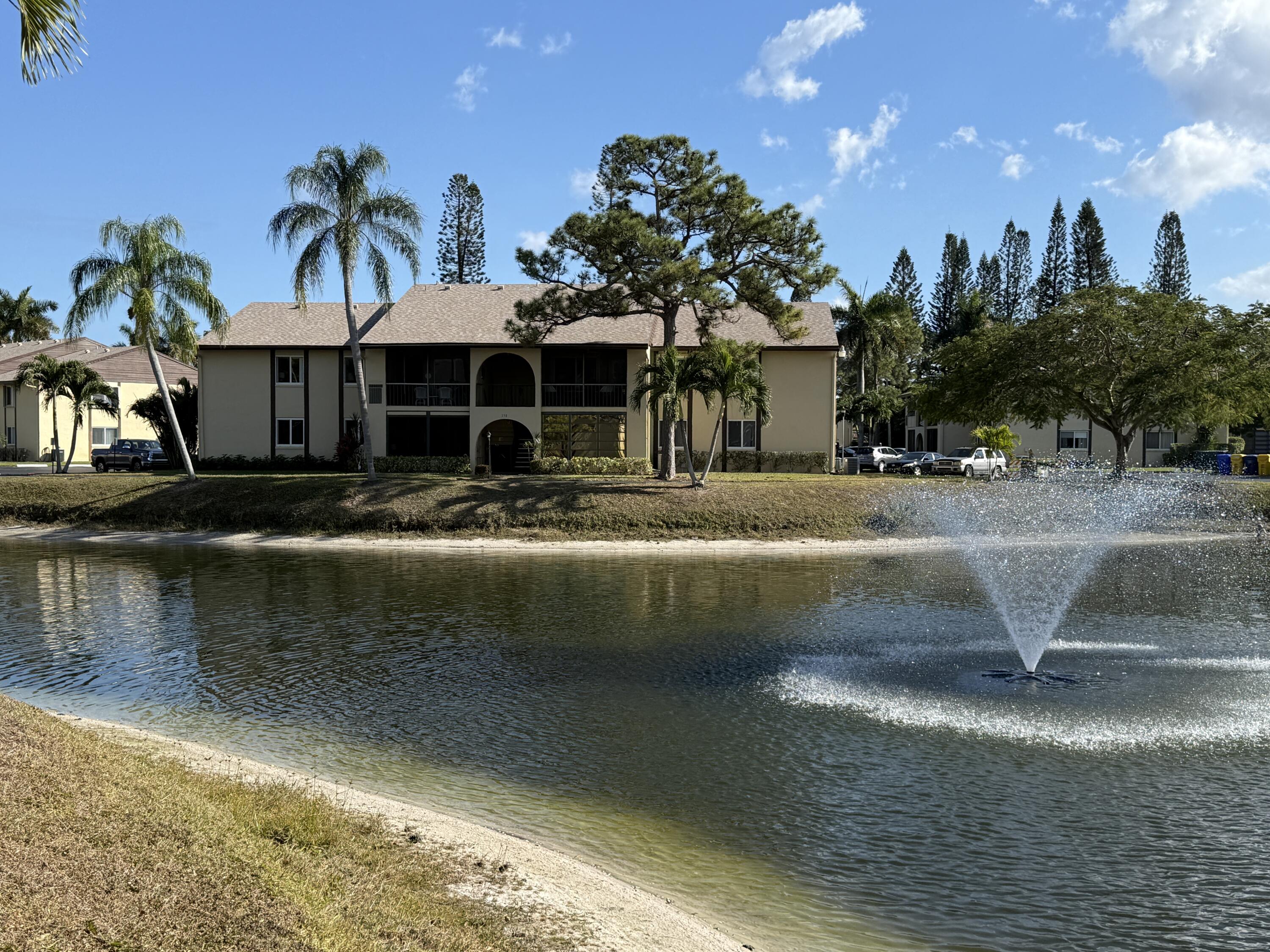 338 Pine Ridge Circle, Unit B2 Greenacres, FL 33463 - Photo 40 of 56 a view of a water fountain in front of house