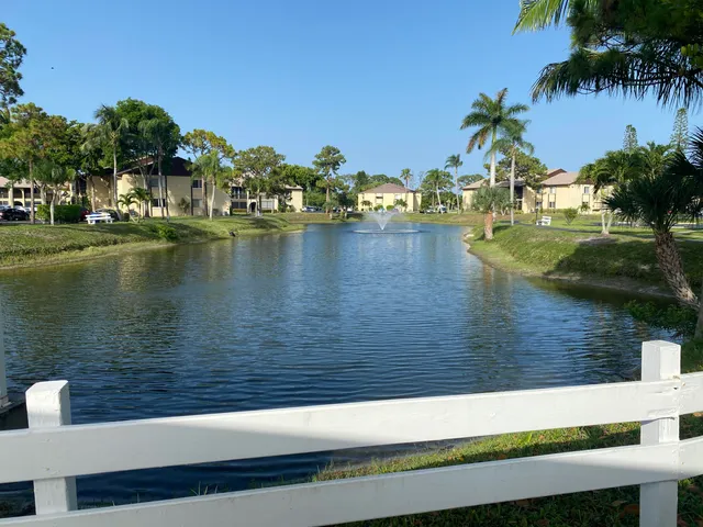 a view of a swimming pool with an outdoor seating and yard