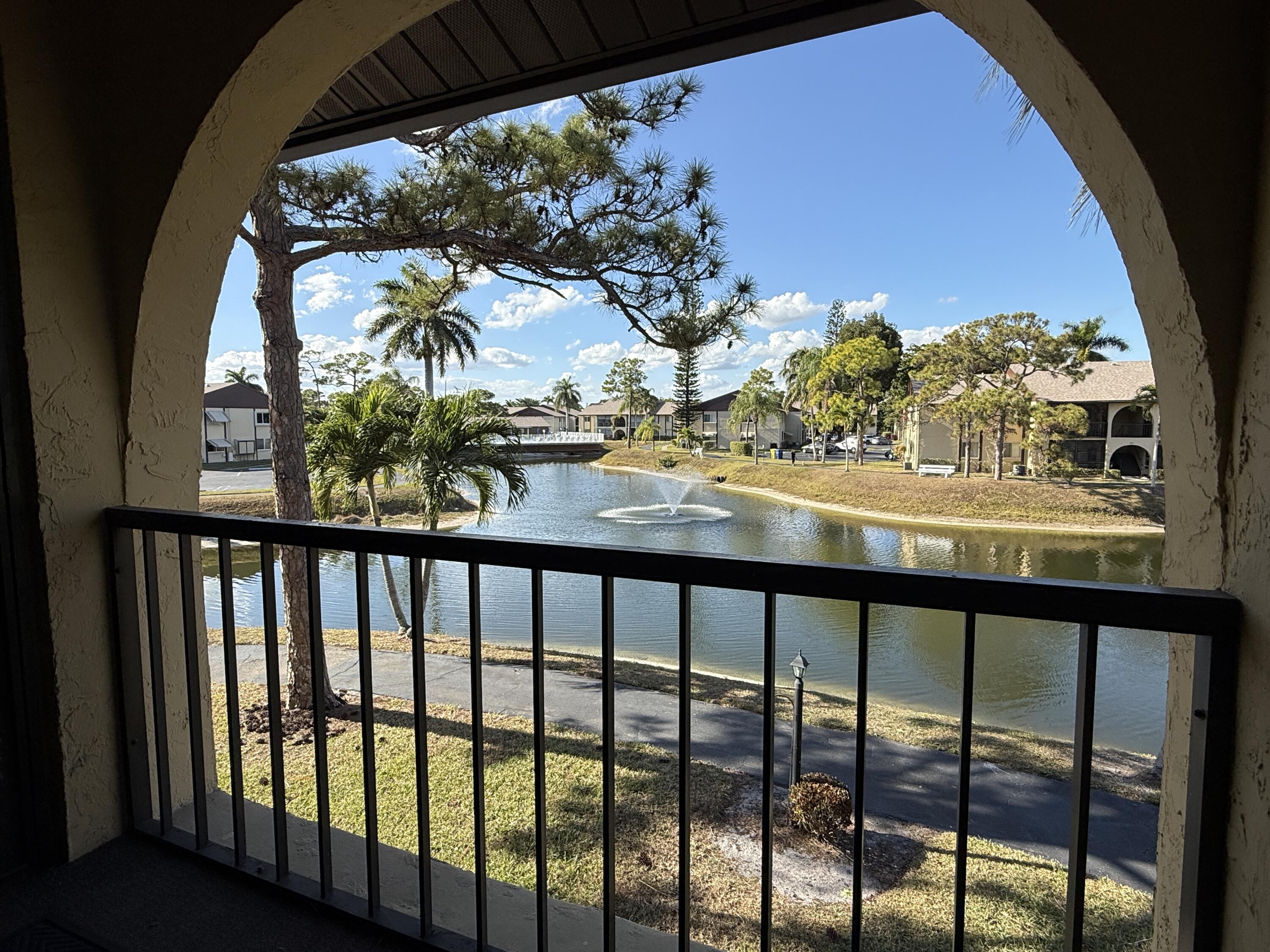 338 Pine Ridge Circle, Unit B2 Greenacres, FL 33463 - Photo 6 of 56 a view of a city from a balcony