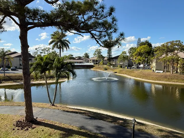 a view of swimming pool with a table and chairs