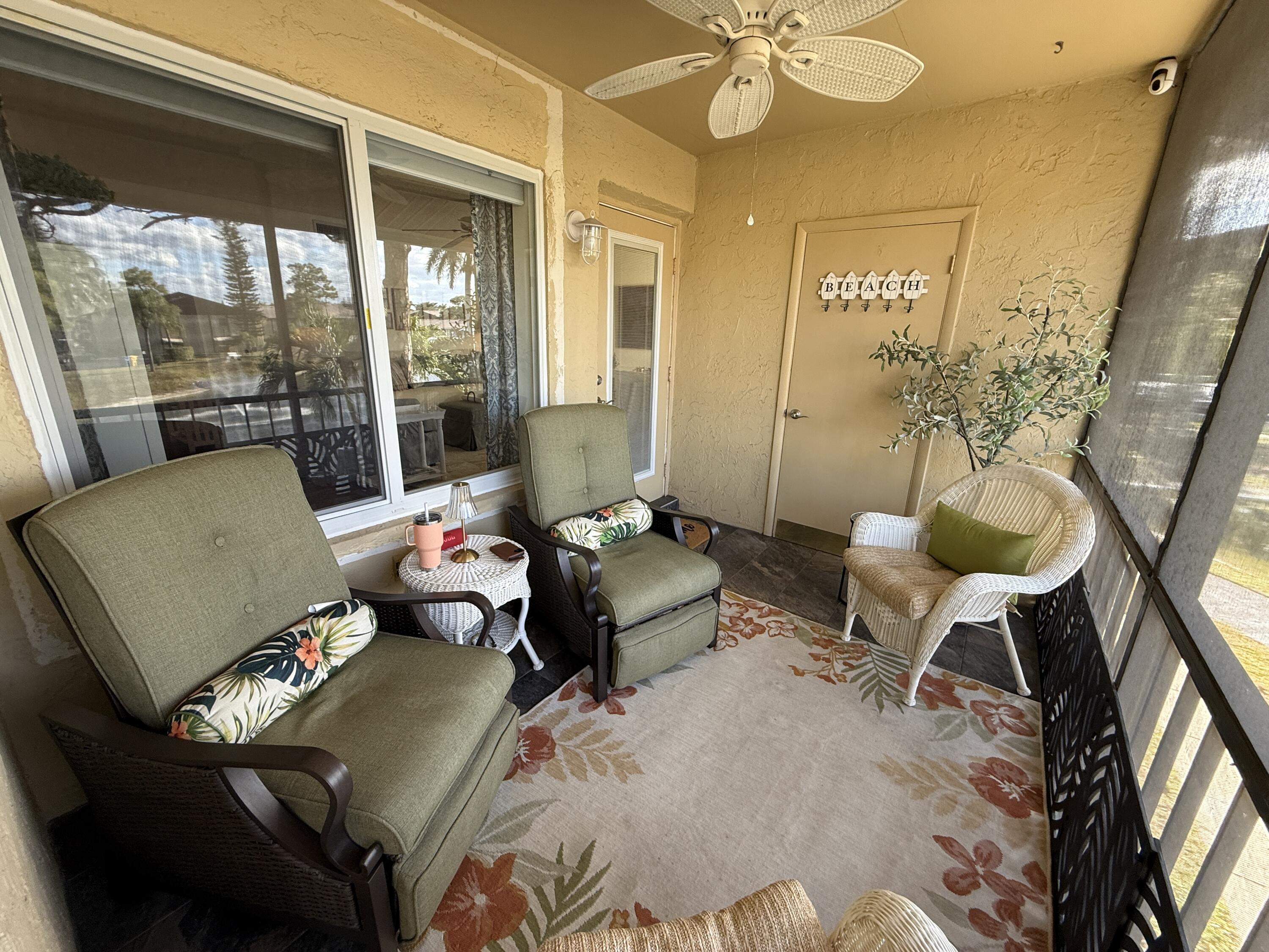 338 Pine Ridge Circle, Unit B2 Greenacres, FL 33463 - Photo 9 of 56 a living room with furniture and a large window