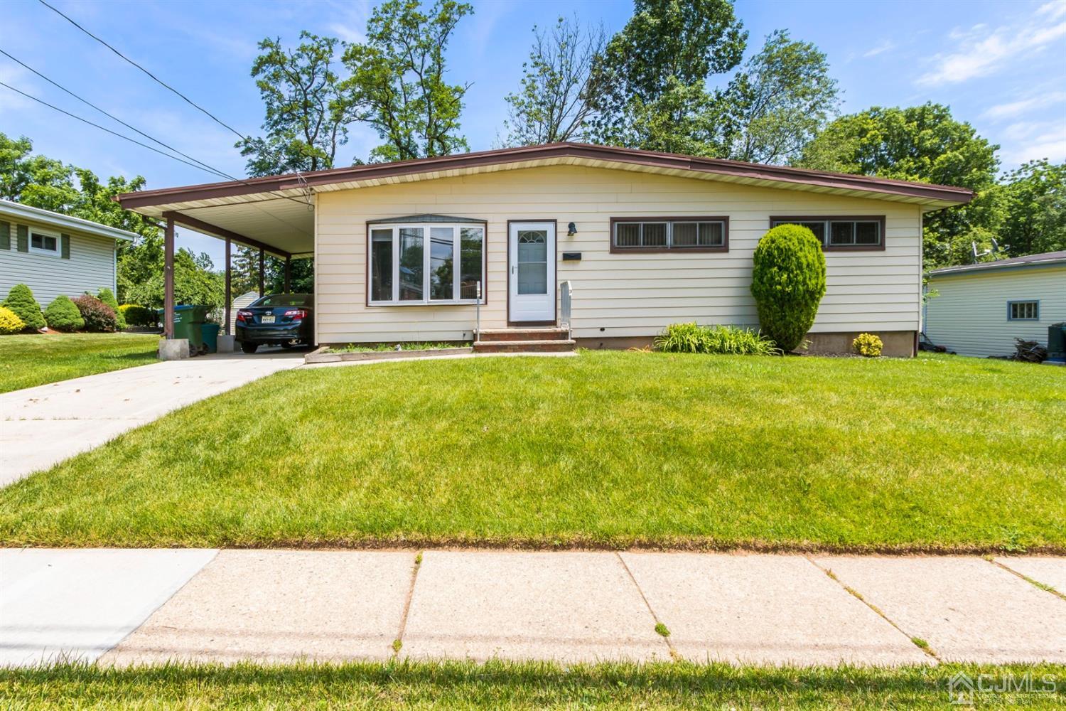 27 Mill Road Edison, NJ 08817 - Photo 2 of 31 a view of a white house with a yard