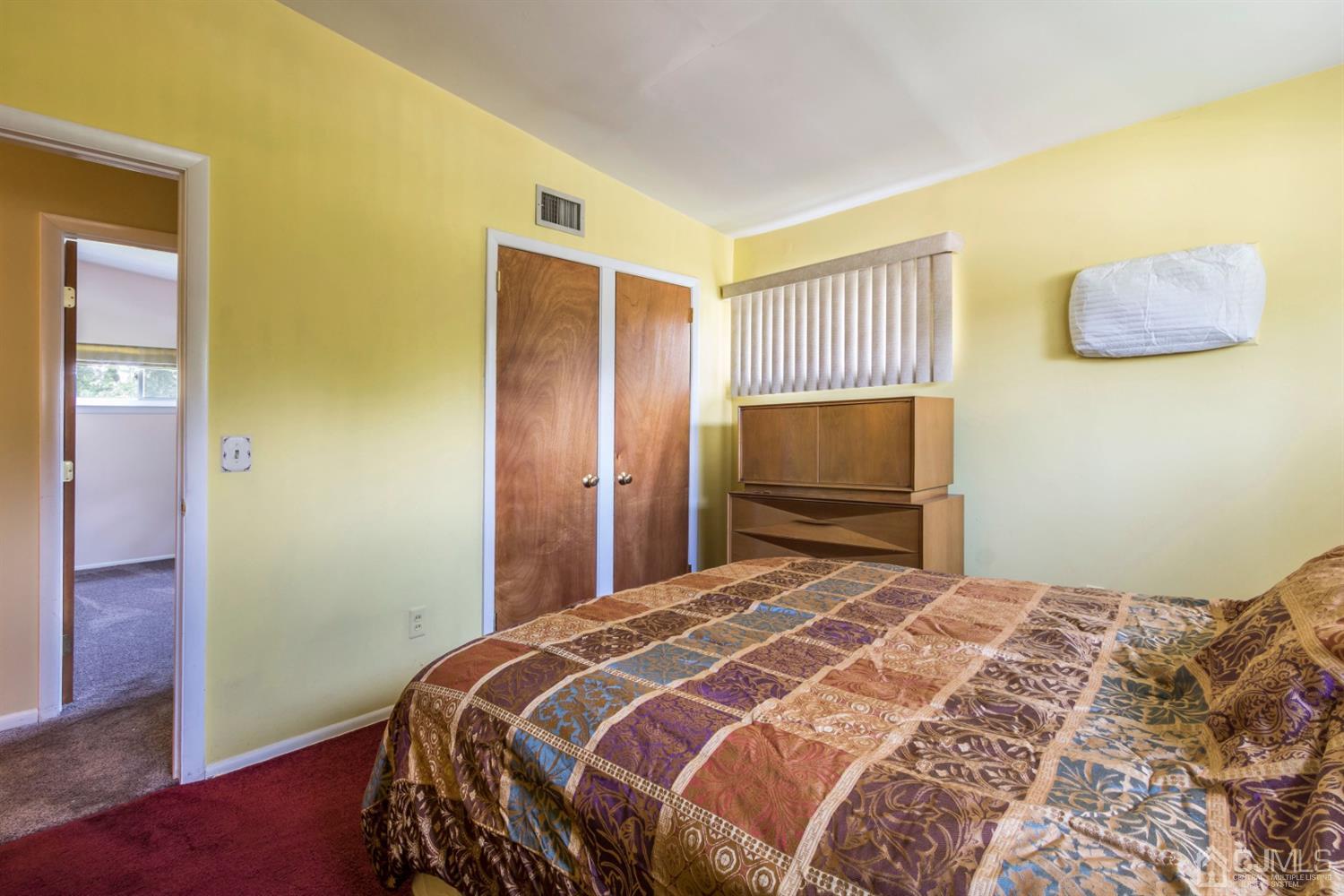 27 Mill Road Edison, NJ 08817 - Photo 15 of 31 a bedroom with a bed and a room