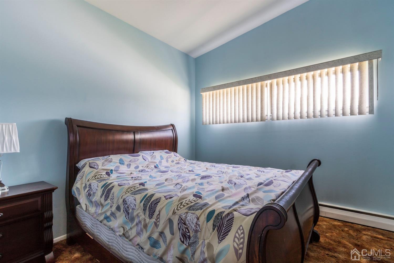27 Mill Road Edison, NJ 08817 - Photo 16 of 31 a bedroom with a bed and a window