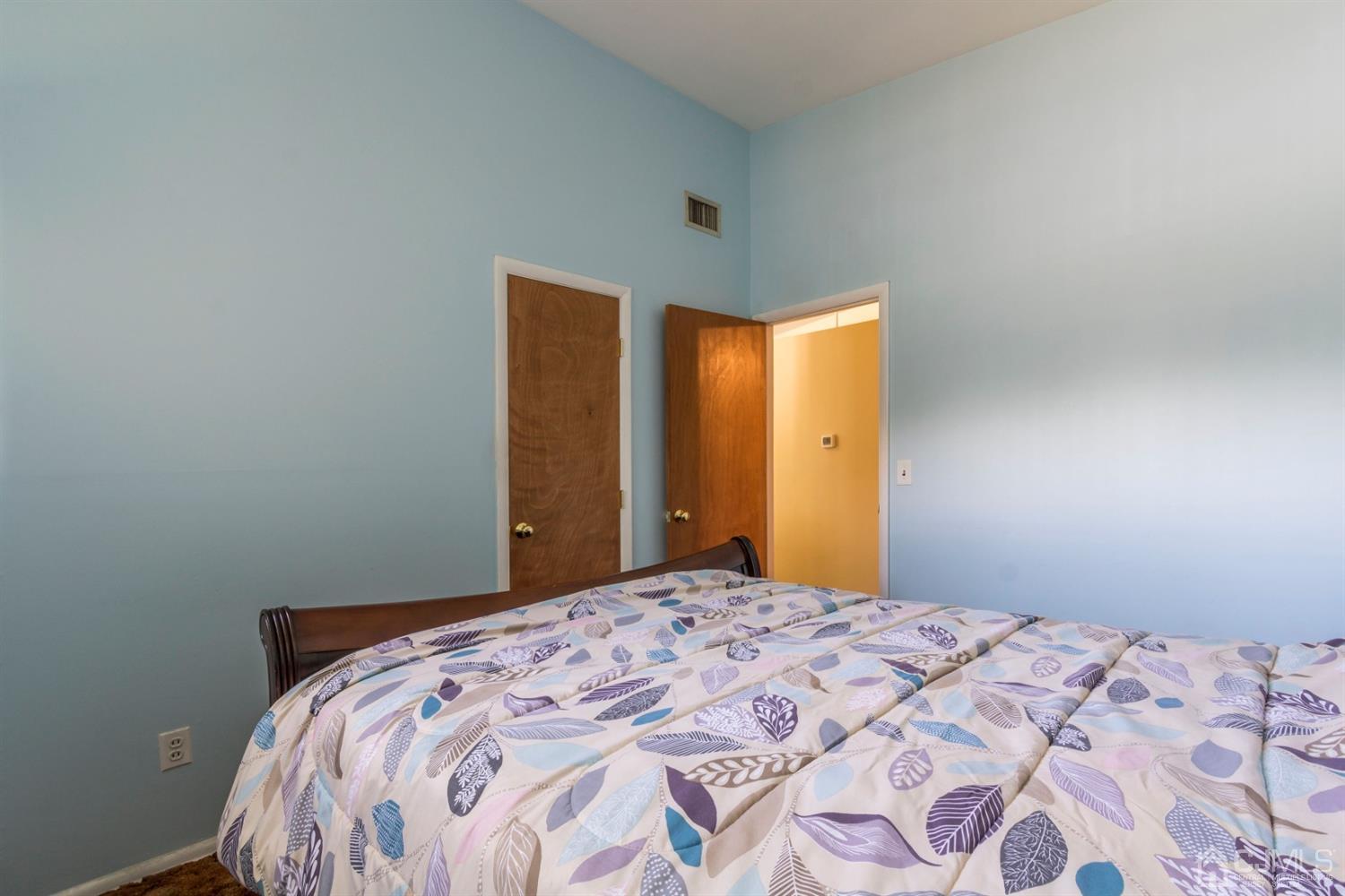 27 Mill Road Edison, NJ 08817 - Photo 17 of 31 a bedroom with a bed and a dresser