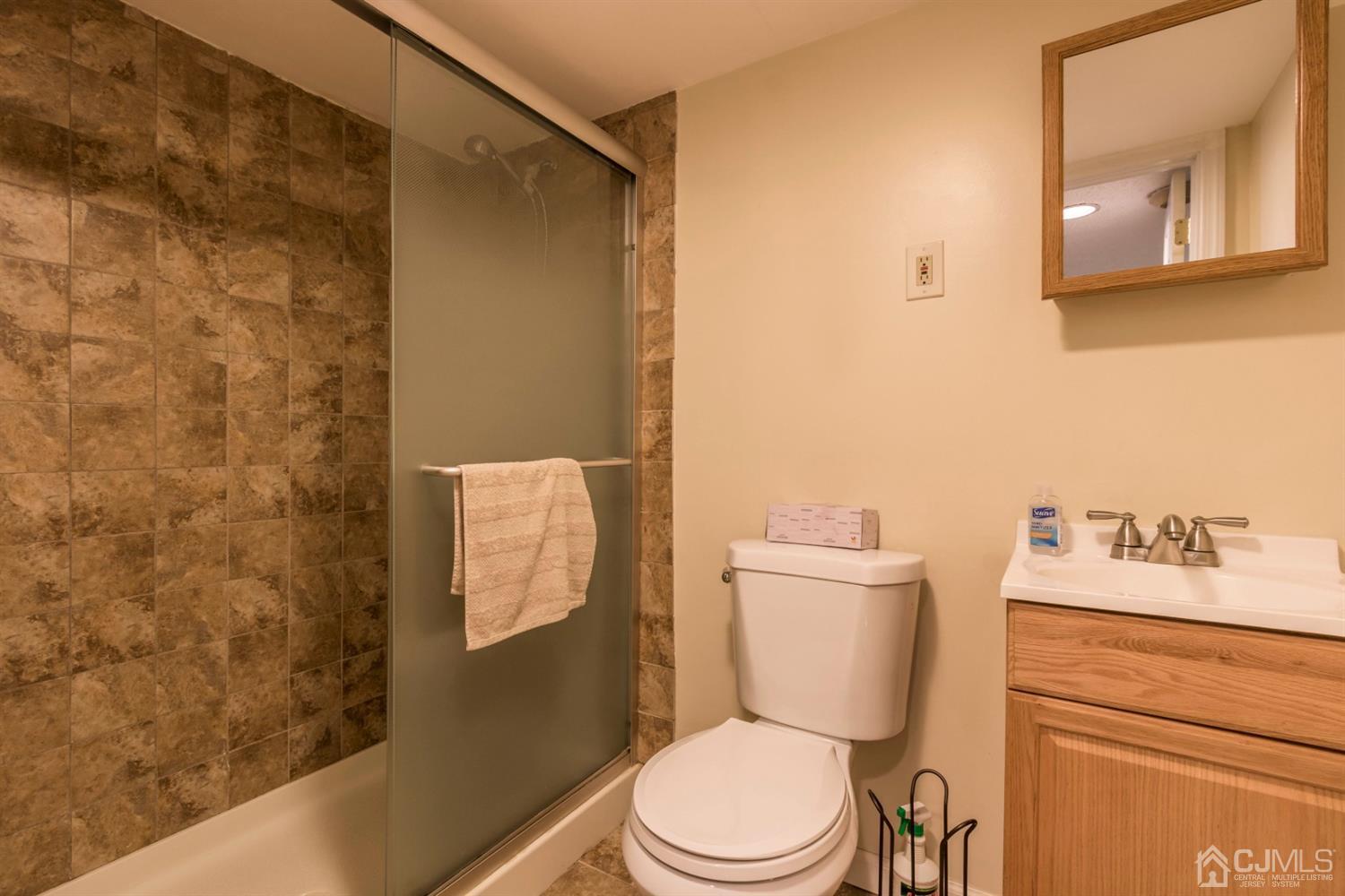 27 Mill Road Edison, NJ 08817 - Photo 25 of 31 a white toilet sitting next to a bathroom sink