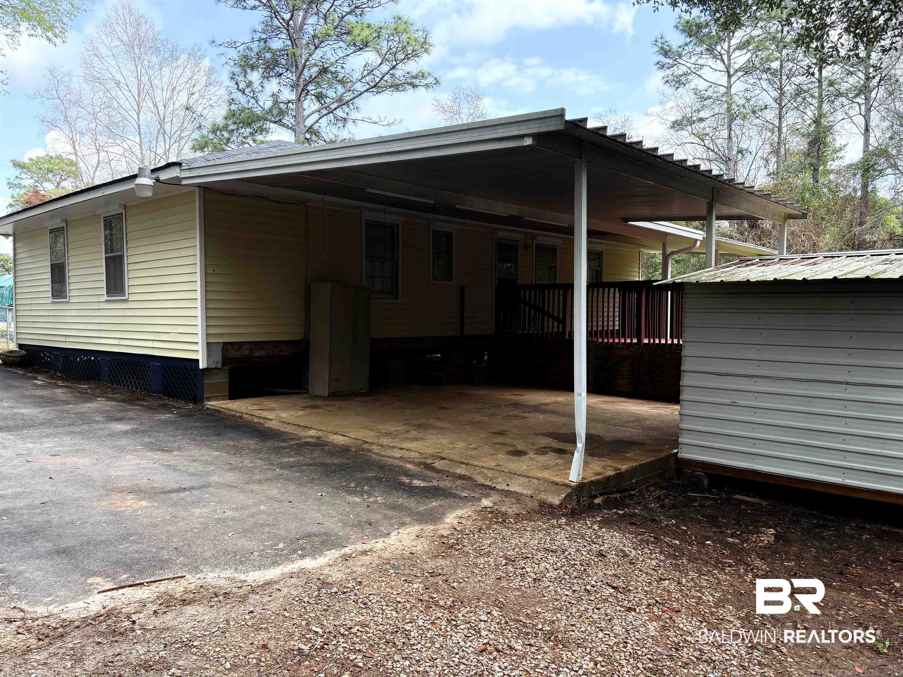 8065 Middle Ring Road Mobile, AL 36619 - Photo 15 of 21 Exterior space with an attached carport and driveway