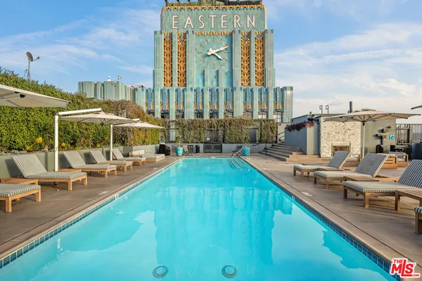 a view of swimming pool with outdoor seating