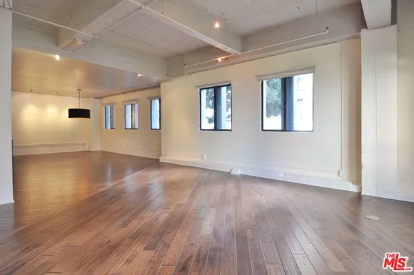 a view of a livingroom with wooden floor