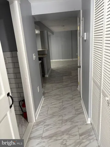a kitchen with granite countertop a sink and a stove