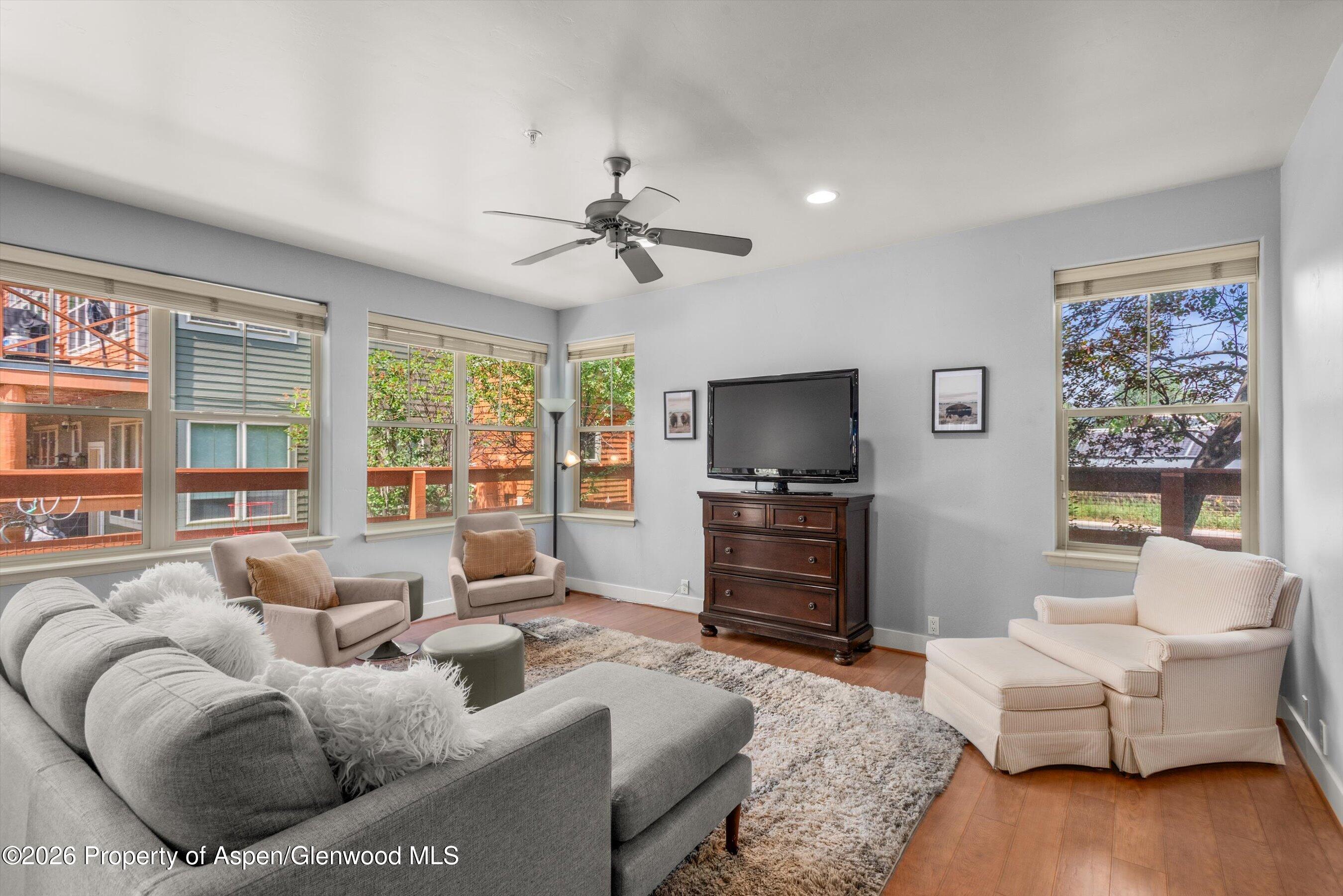 548 Evans Court Basalt, CO 81621 - Photo 14 of 36 a living room with furniture and a flat screen tv