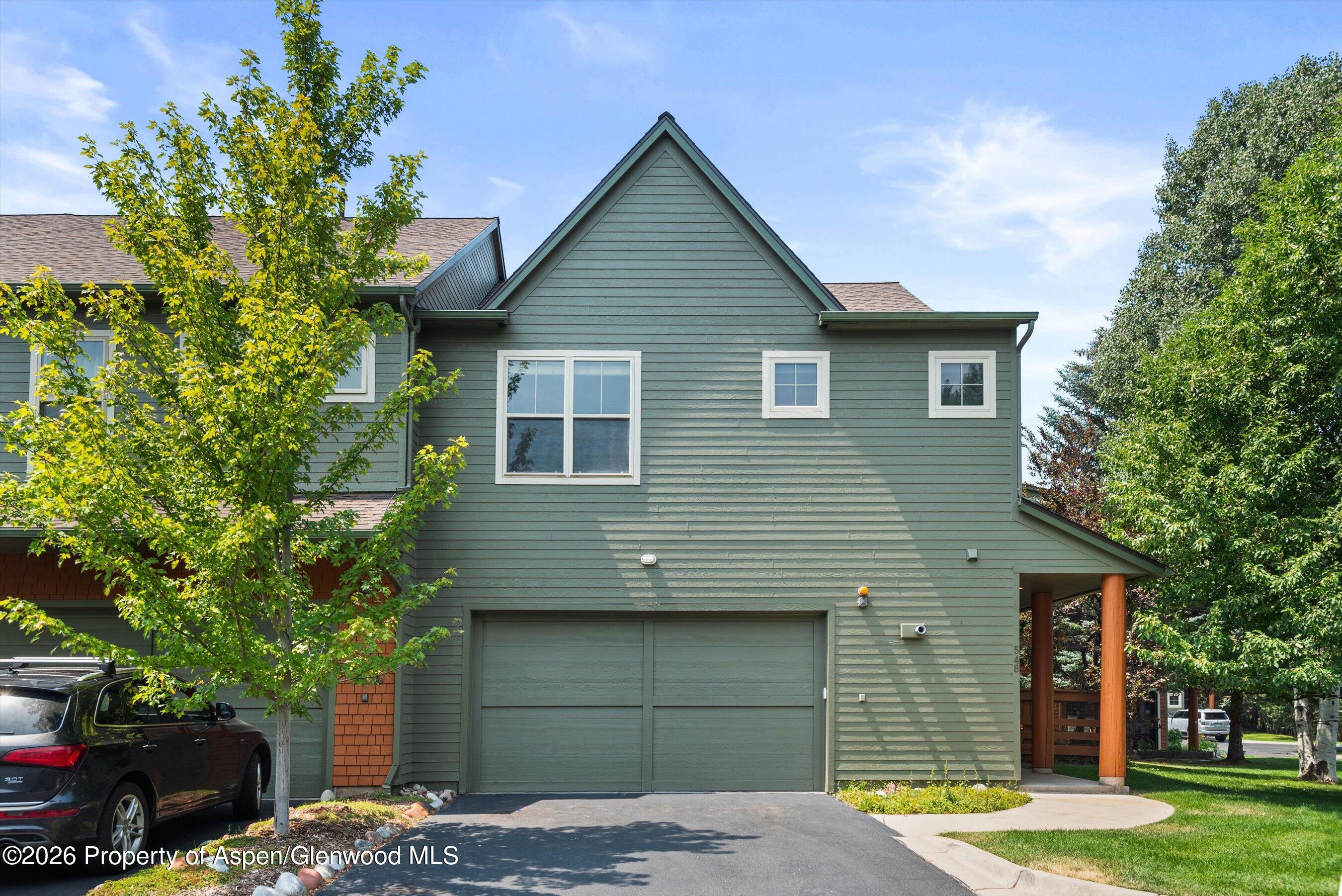 548 Evans Court Basalt, CO 81621 - Photo 17 of 36 a front view of a house with garden