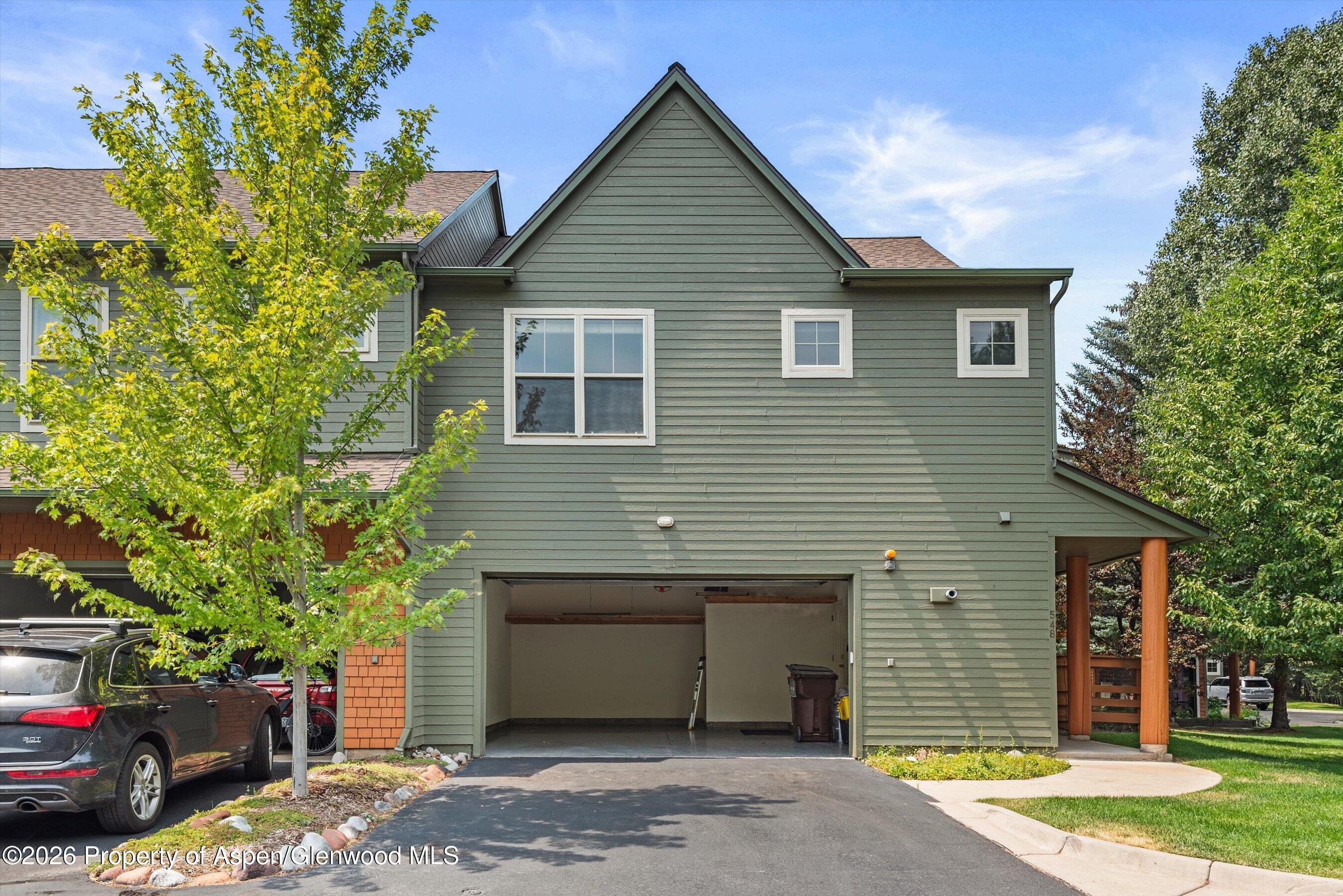 548 Evans Court Basalt, CO 81621 - Photo 19 of 36 a house that has a tree in front of the house