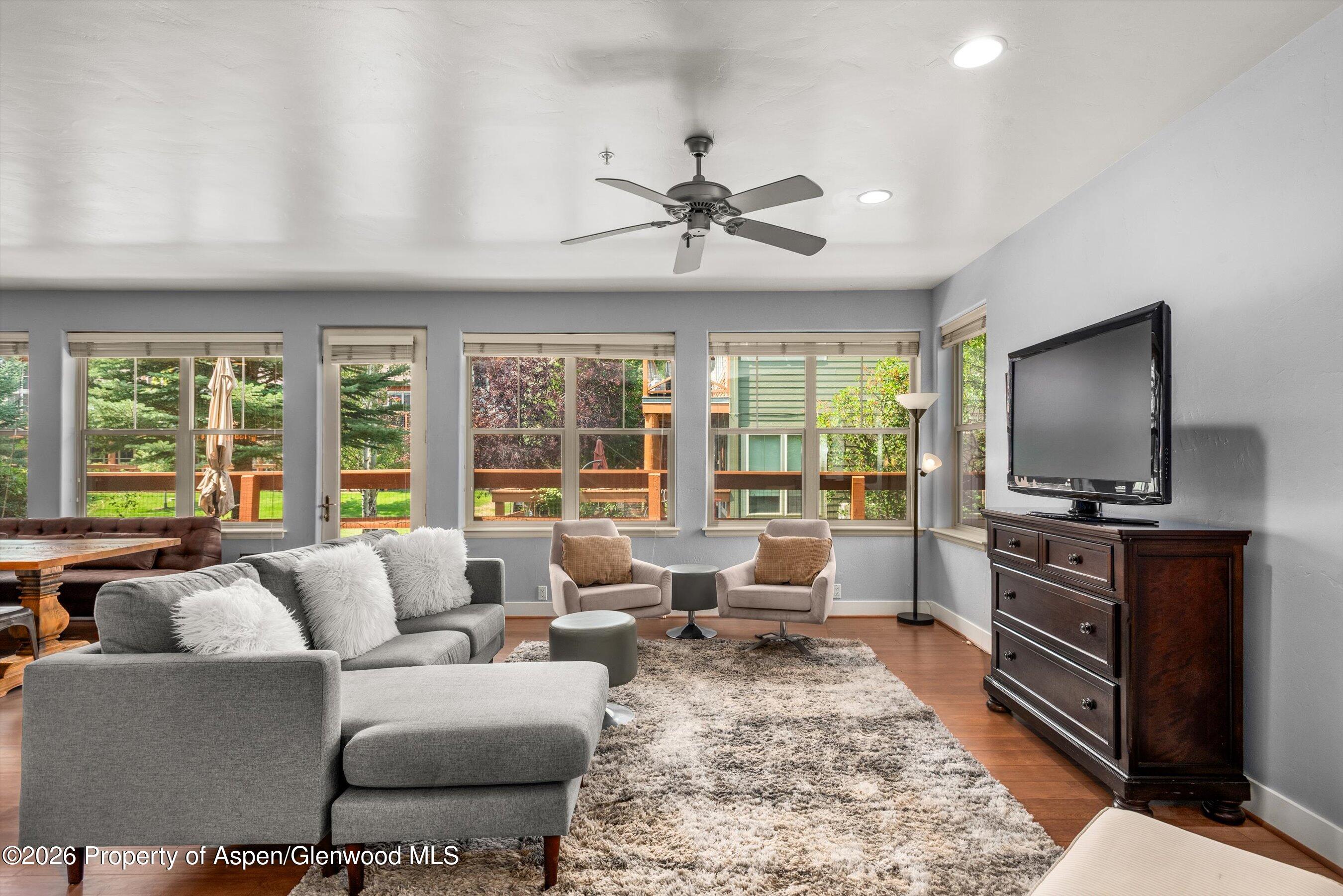 548 Evans Court Basalt, CO 81621 - Photo 2 of 36 a living room with furniture and a flat screen tv